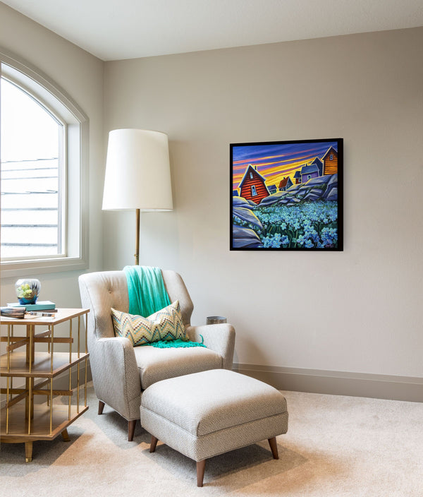 Forget Me Nots by Adam Young framed beside an armchair and reading lamp