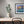 Load image into Gallery viewer, Forget Me Nots by Adam Young framed above a desk
