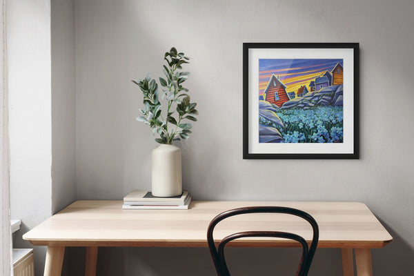 Forget Me Nots by Adam Young framed above a desk