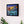 Load image into Gallery viewer, Forget Me Nots by Adam Young framed on a white wall above a sideboard

